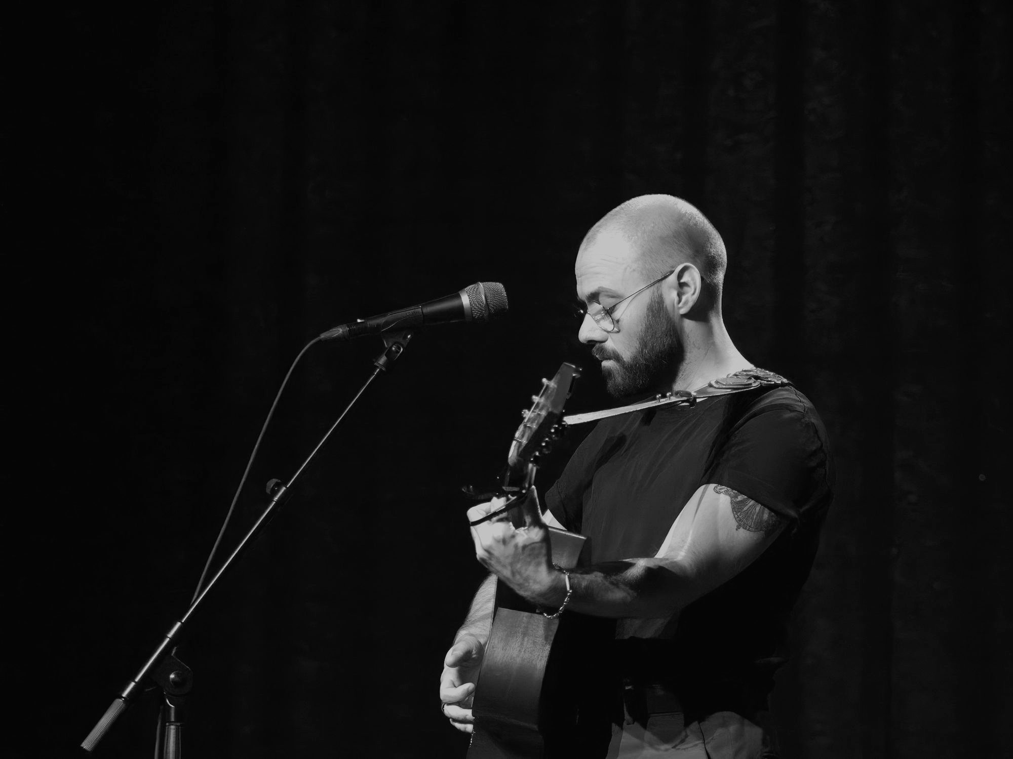 Marc Facchini on stage with guitar